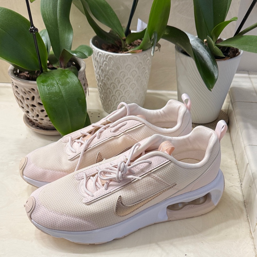 Nike Women's Light Pink Air Sneakers with rose gold swoosh